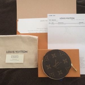 Like new round LV coin purse.